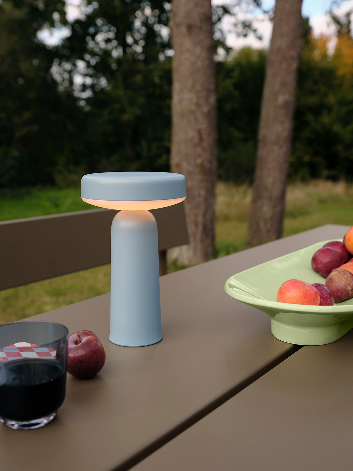 /cdn-cgi/image/width=1500,quality=85,format=auto/globalassets/content-media/images/01.-lifestyle-images/january-26/ease-portable-lamp-light-blue-linear-steel-table-bench-taupe-mere-bowl-raise-glass-low-res.jpg