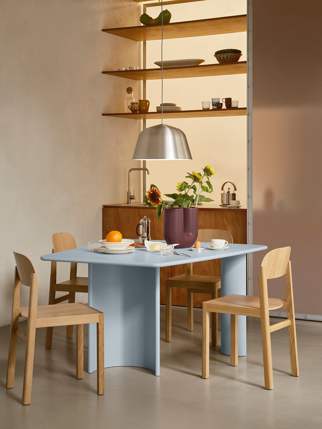 /cdn-cgi/image/width=1500,quality=85,format=auto/globalassets/content-media/images/01.-lifestyle-images/january-26/re-norm-table-130-light-blue-workshop-chair-oak-ambit-pendant-40-brushed-steel-kink-deep-red-low-res.jpg