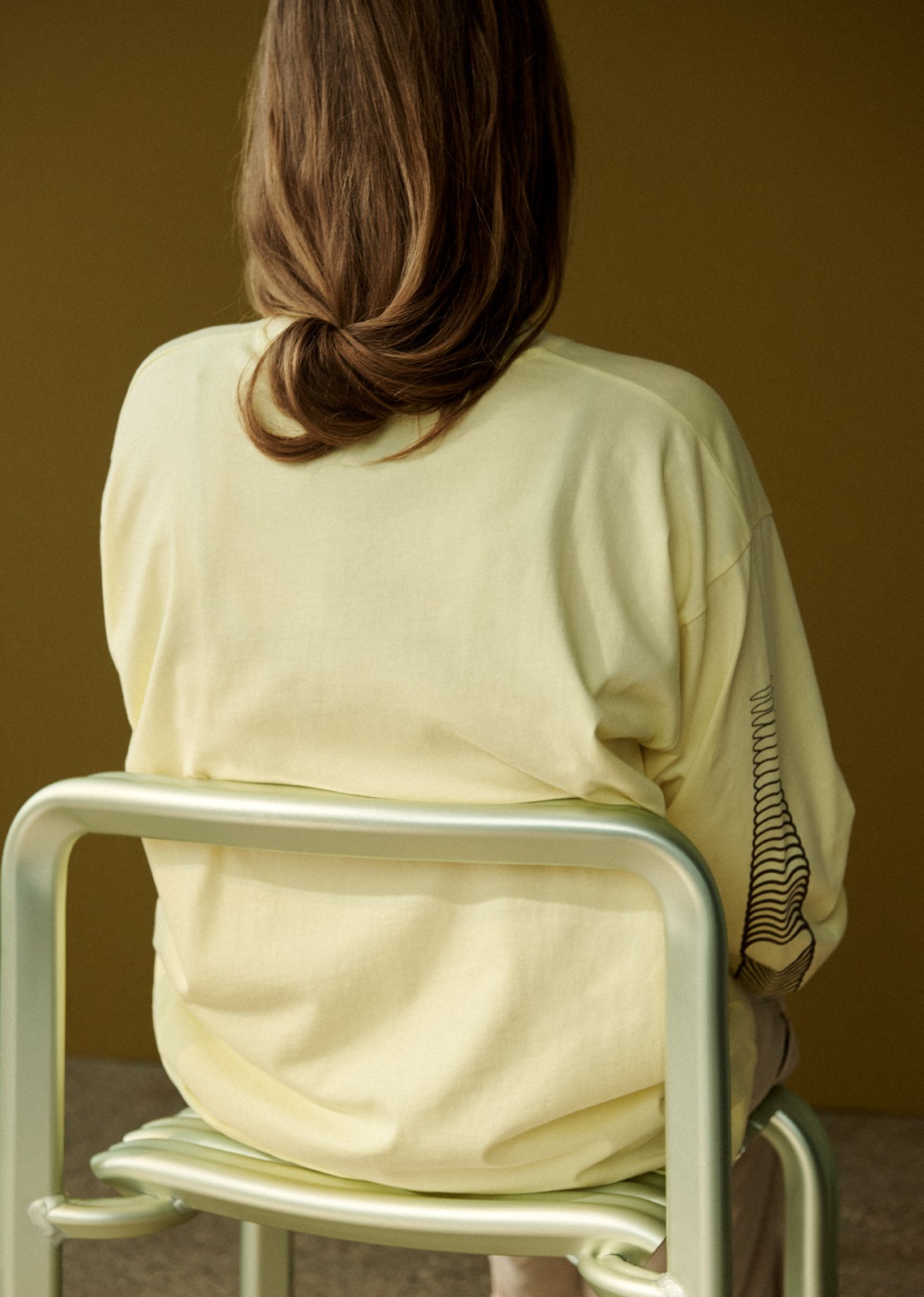 /cdn-cgi/image/width=1500,quality=85,format=auto/globalassets/content-media/images/stories/product-stories/close-to-heartspacon/next-chapters-close-to-heart-chair-longsleeve-tee-yellow-low-res.jpg