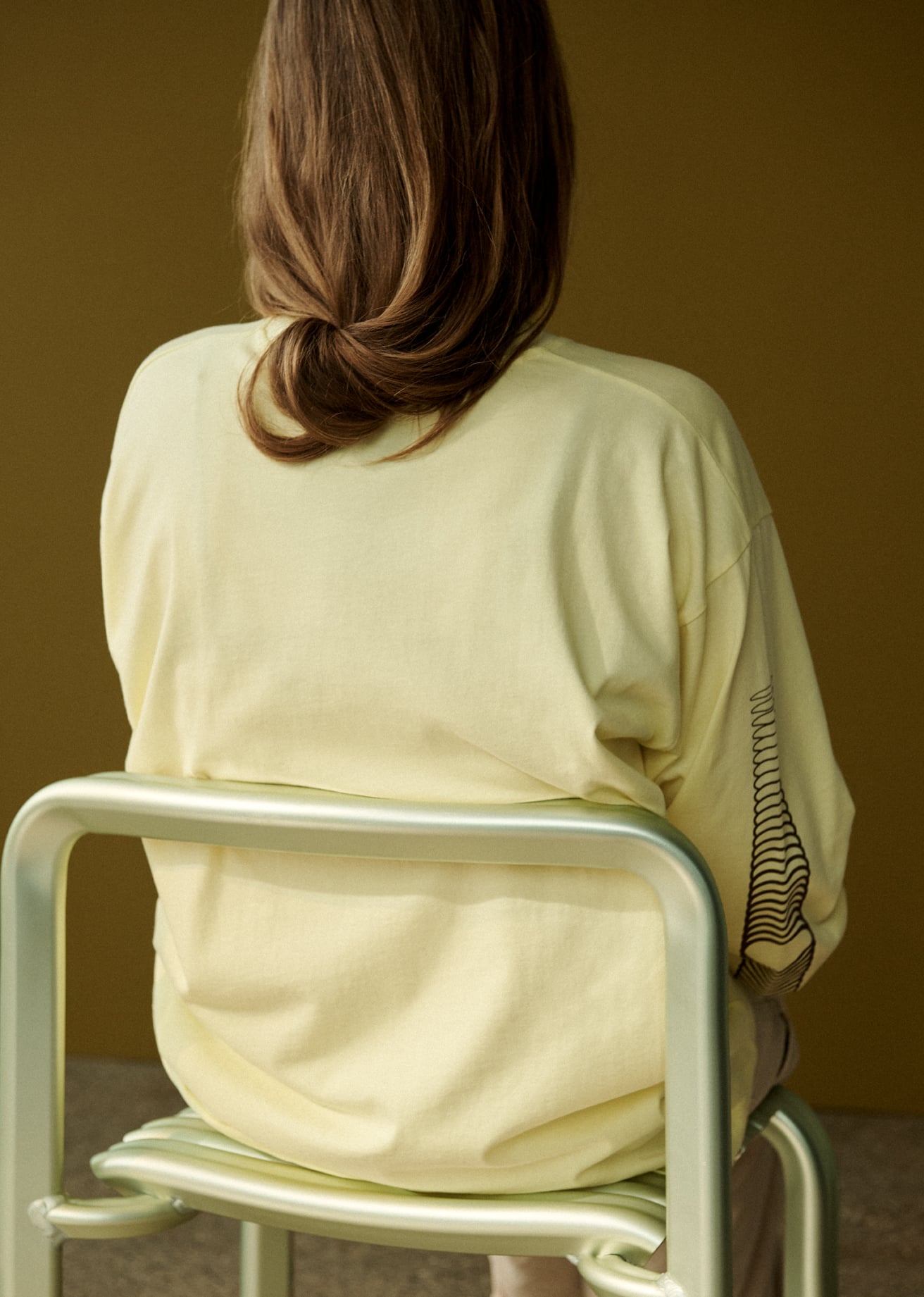 /globalassets/content-media/images/20-year-and-3days/close-to-heart/next-chapters-close-to-heart-chair-longsleeve-tee-yellow-low-res.jpg?revision=639158989720000000