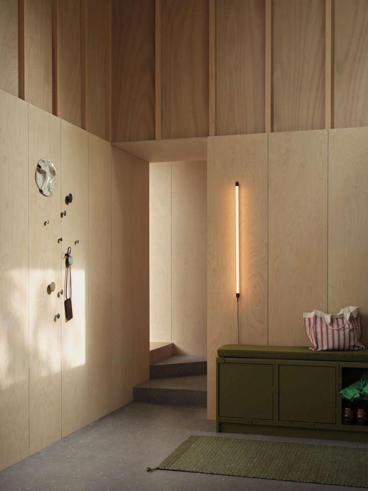 /globalassets/content-media/images/plp/storage/hallway-storage/stacked-seat-cushion-steelcut-985-ply-rug-recycled-polyester-moss-green-dots-fine-wall-lamp-muuto-low-res.jpg?revision=639077056920000000