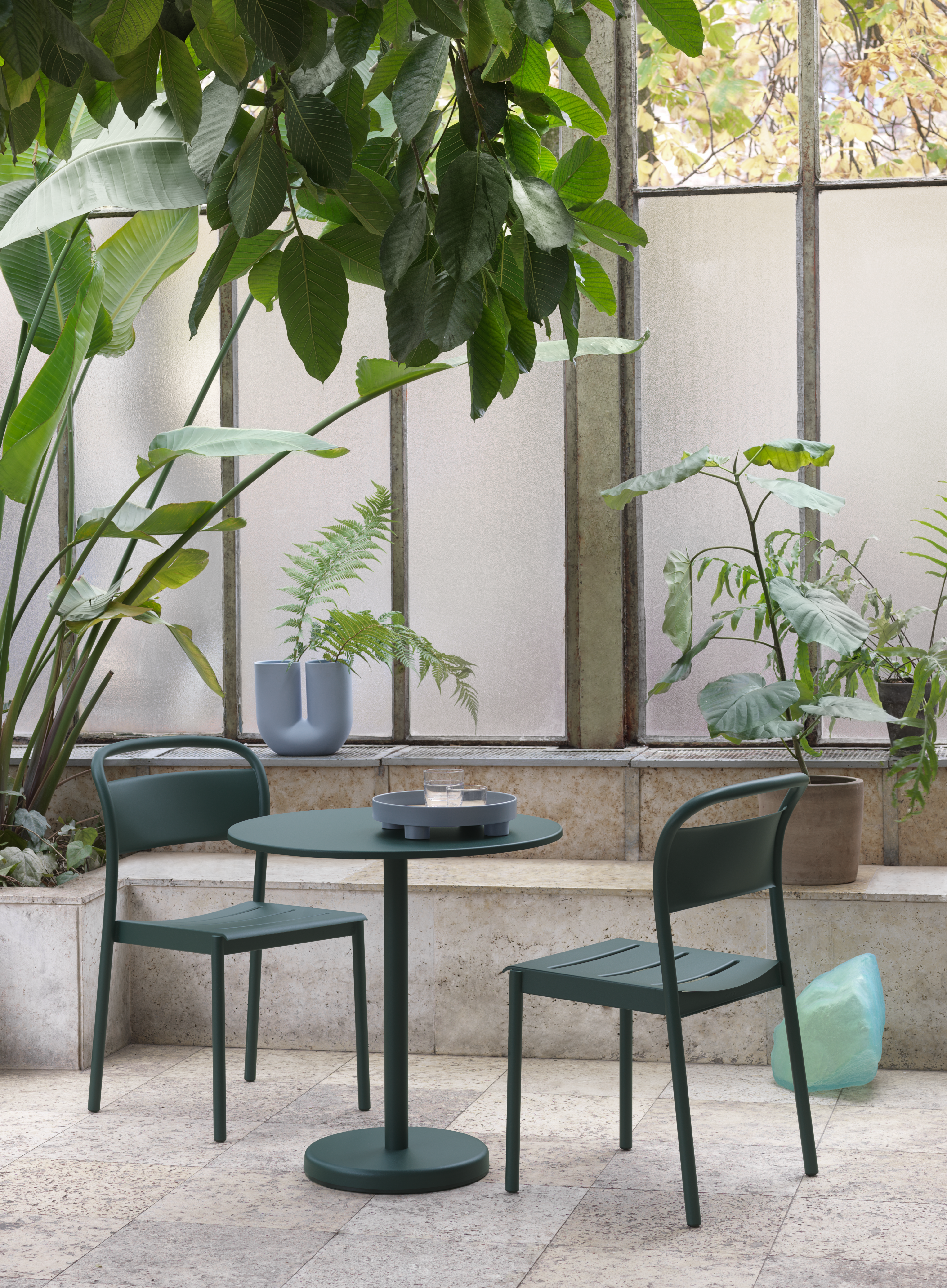 Linear Steel Side Chair in Dark Green, Linear Steel Café Table Ø70 in Dark Green, Platform Tray, Kink Vase in Blue