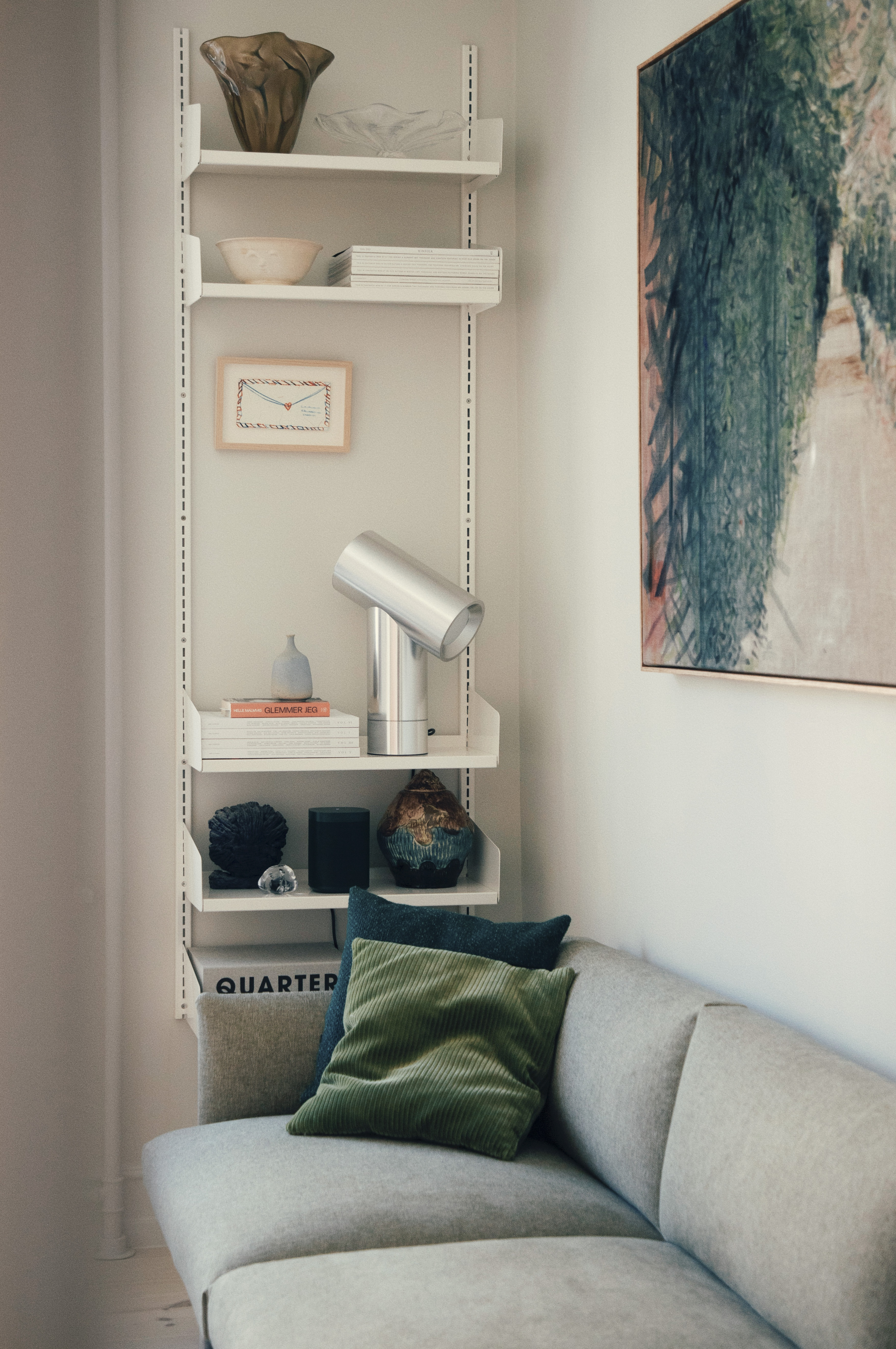 The Outline Sofa by Muuto in Michael Schneider’s home, placed in a warm and minimal living room setting with soft lighting and neutral tones.
