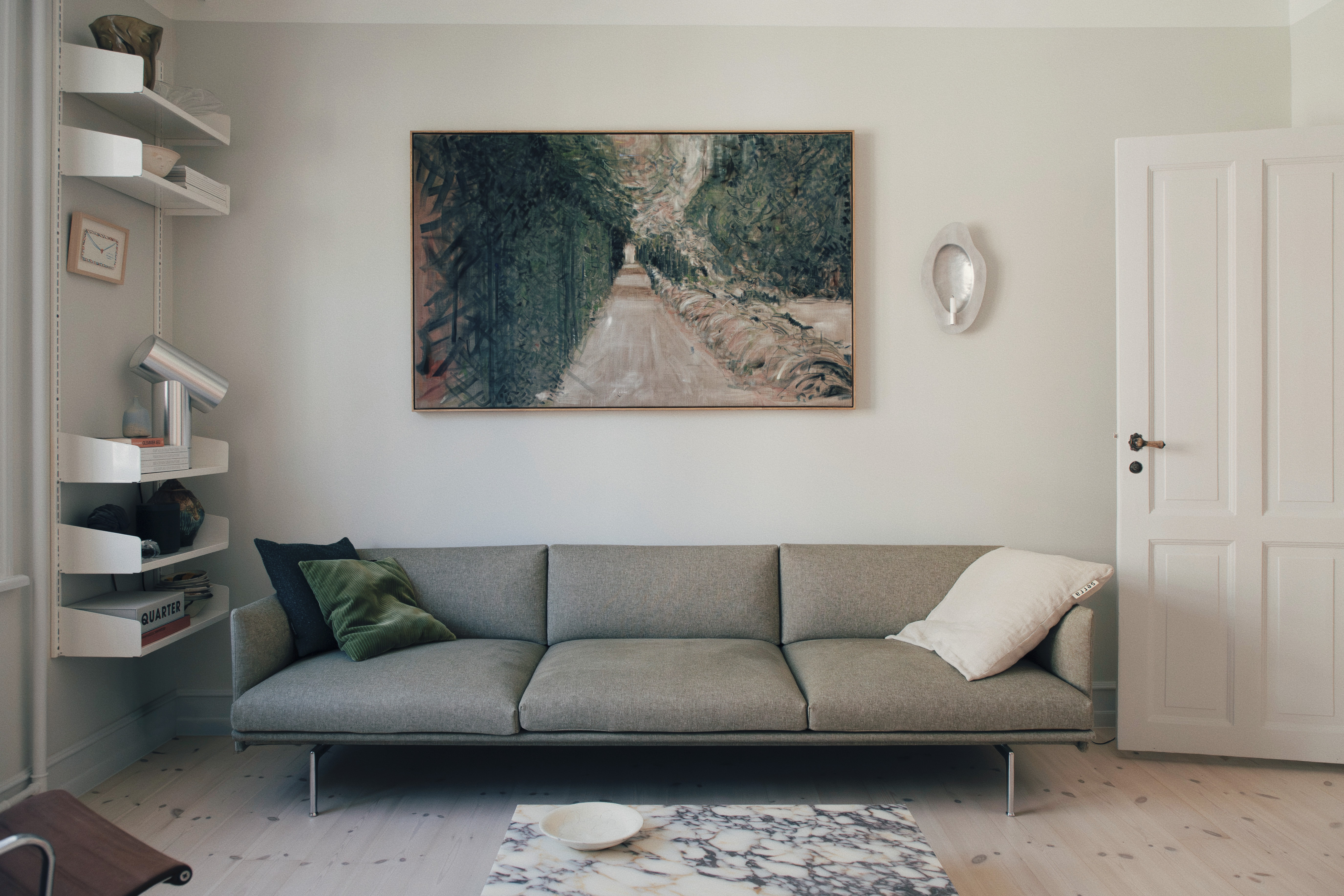The Outline Sofa by Muuto in Michael Schneider’s home, styled in a calm living area with soft textures, neutral tones, and a minimalist atmosphere.
