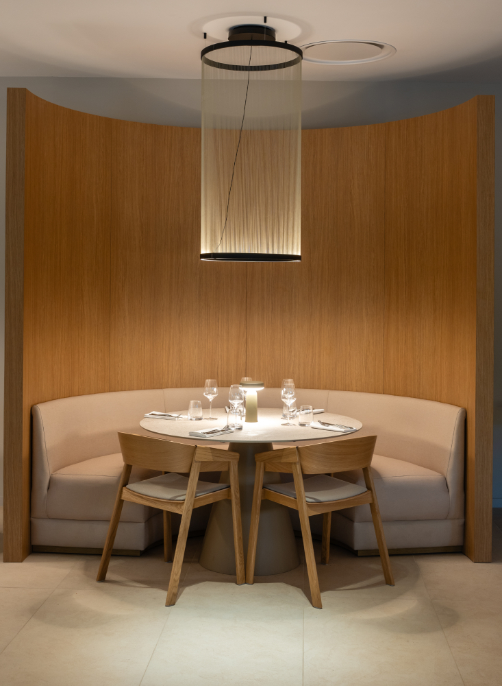 Interior view of Horizon Resort Massane in France featuring Muuto furniture, including the Ease Portable Lamp and Cover Armchair, creating a modern and welcoming hotel atmosphere.