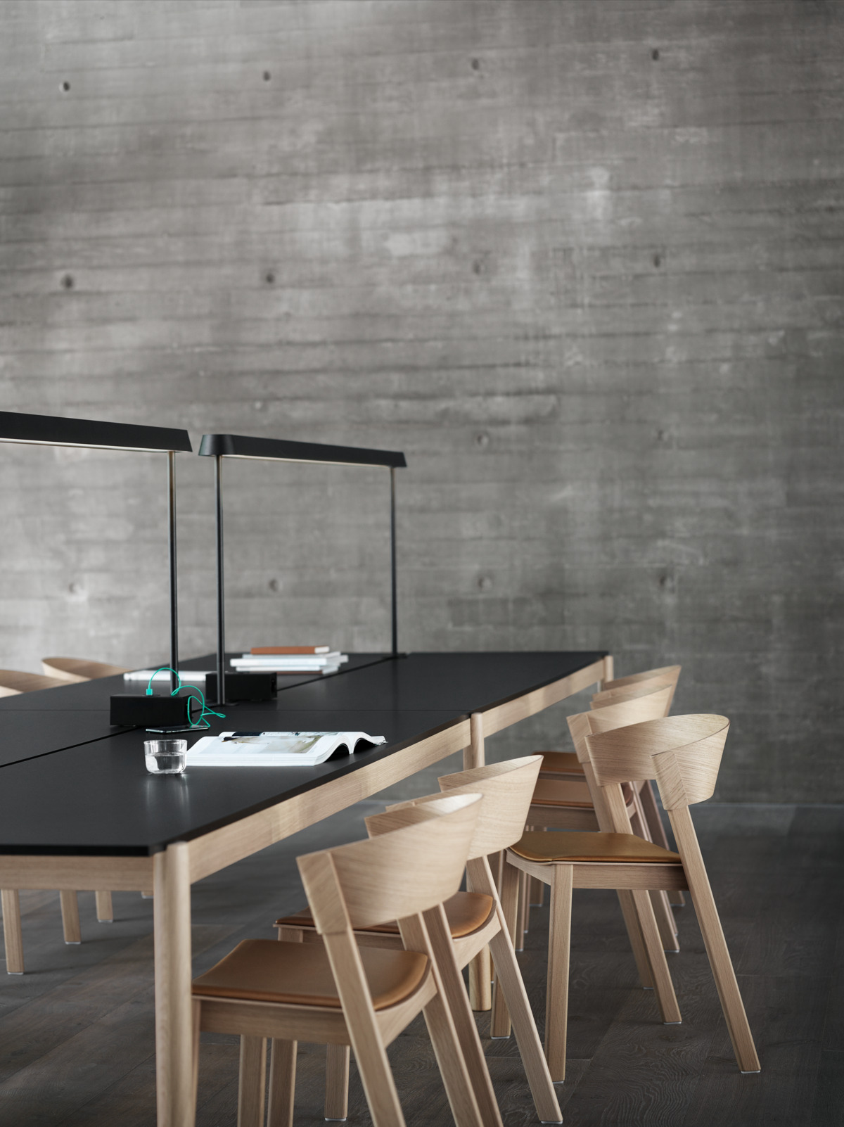 Linear System Table Configuration 2 w. Black Linoleum, Linear Mounted Lamp, Power Outlet in Black, Cover Side Chair Oak/Cognac Refine Leather