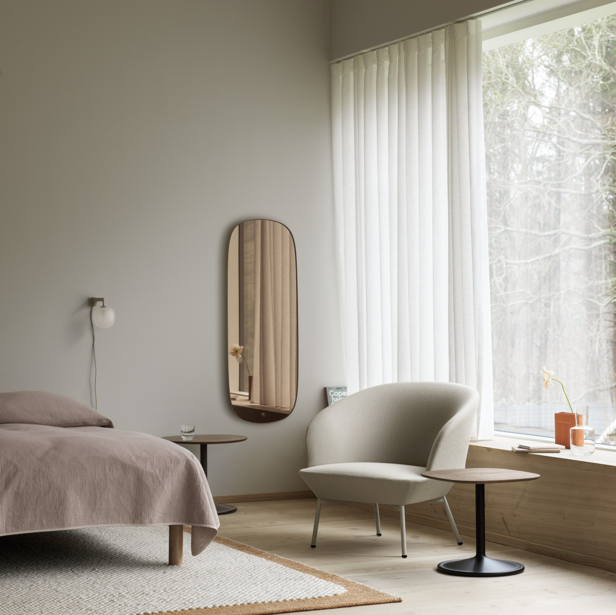 Oslo Lounge Chair w. Grey Tube Base in Vidar 146 - Soft Side Table 45x45 cm in Smoked Solid Wood/Black -  Soft Side Table Ø48 cm in Smoked Solid Wood/Black - Framed Mirror in Rose - Rime Wall Lamp in Grey