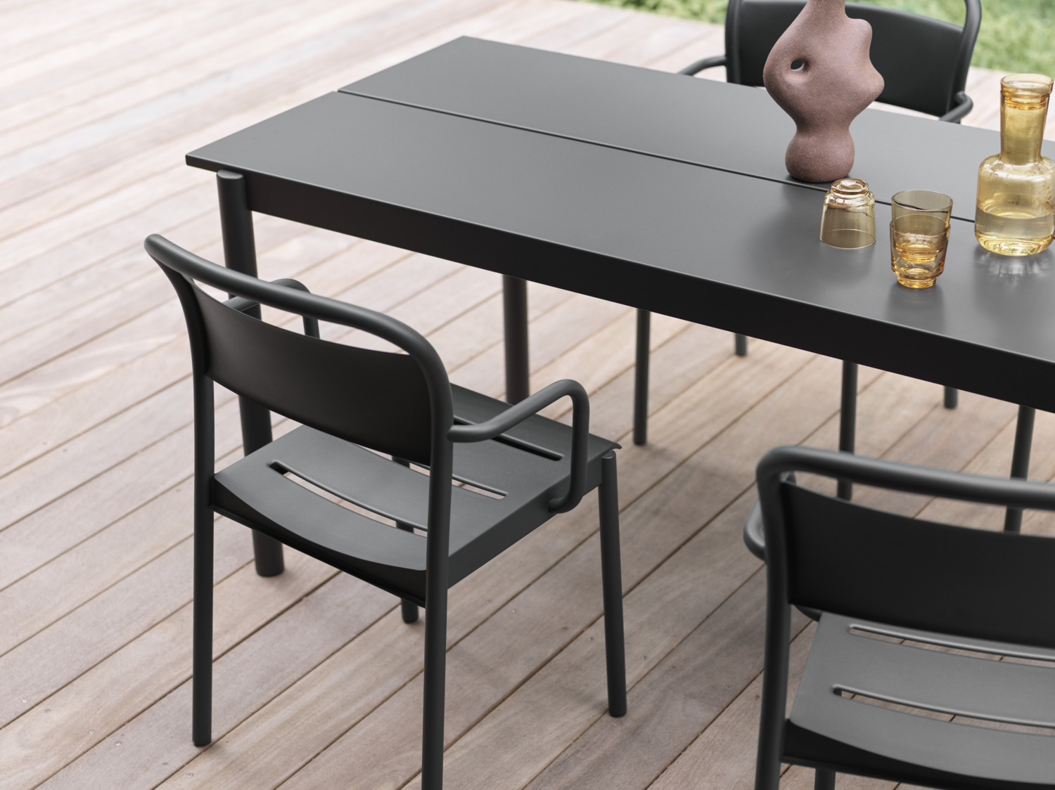 Linear Steel Table in 200 cm - Linear Steel Armchair in Black - Raise Carafe & Glasses in Burnt Orange
