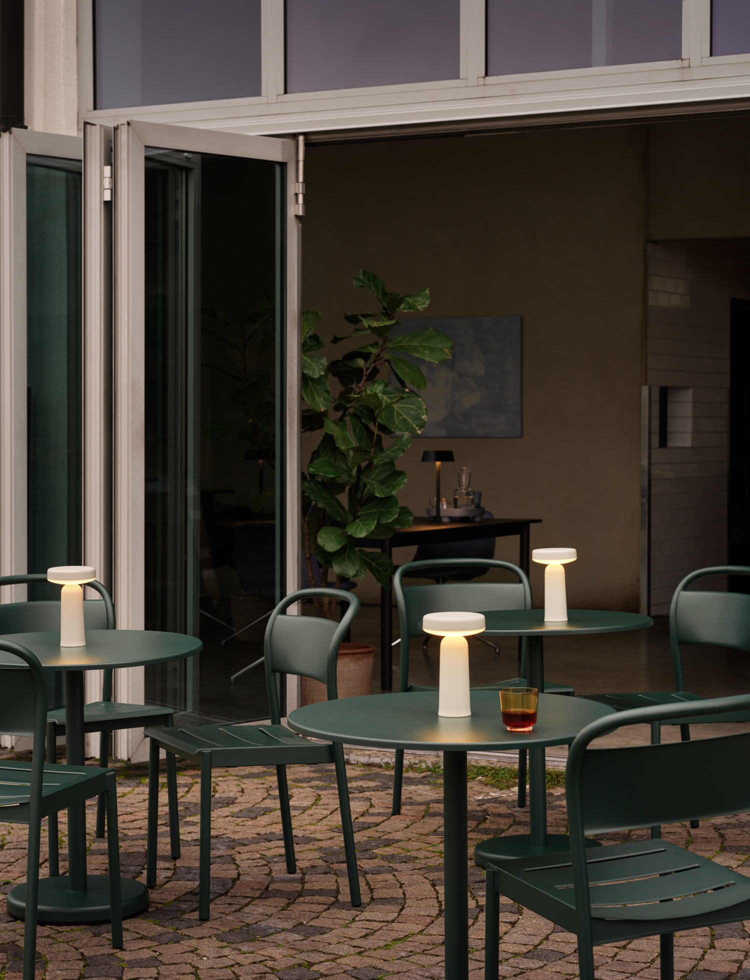 Linear Steel Café Table & Side Chair in Dark Green, Ease Portable Lamp in Grey, Raise Glass in Burnt Orange, Linear System Table in Black
